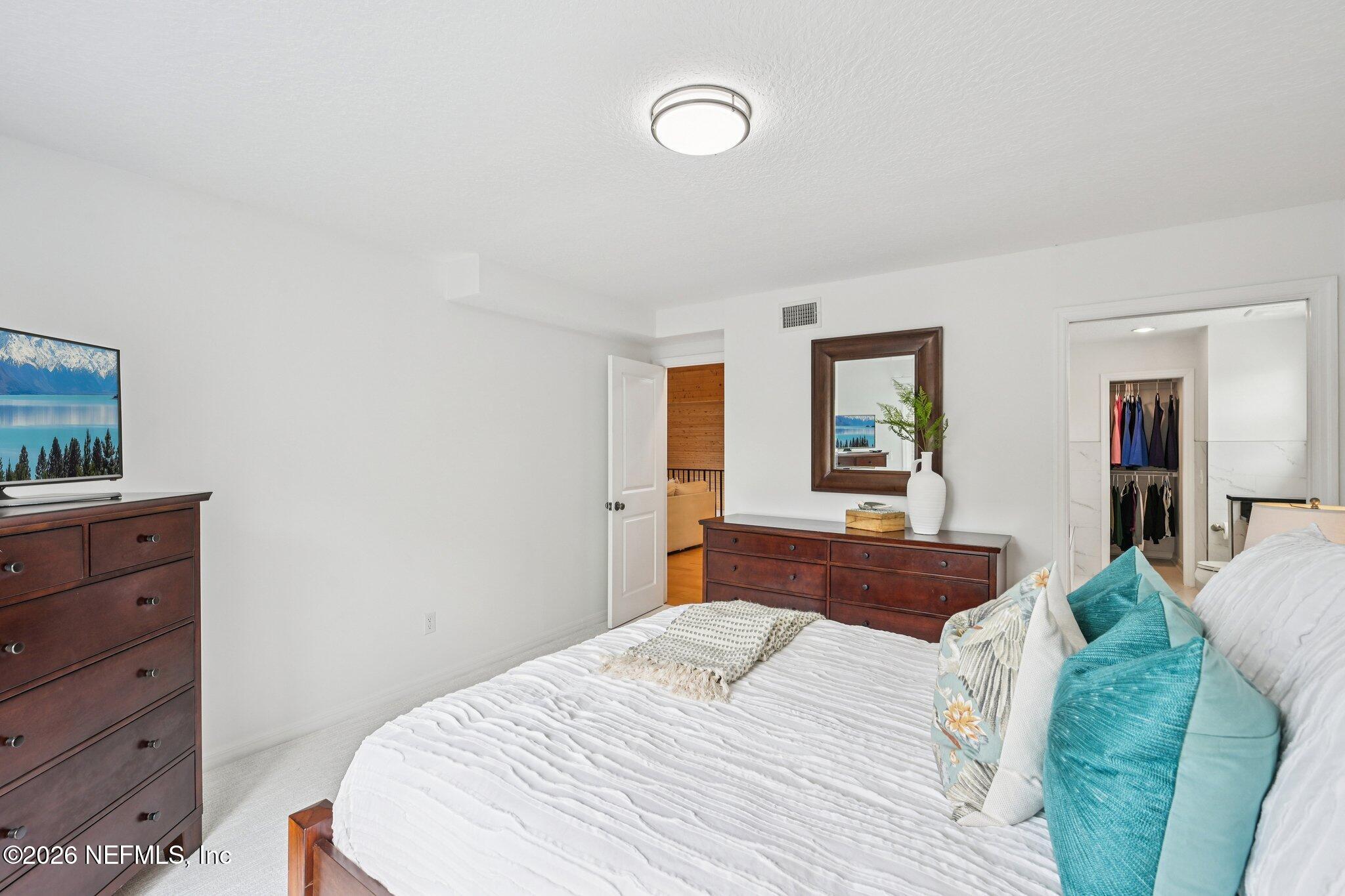2802 2nd Street South Jacksonville Beach, FL 32250 - Photo 31 of 53 a bedroom with a bed and a dresser