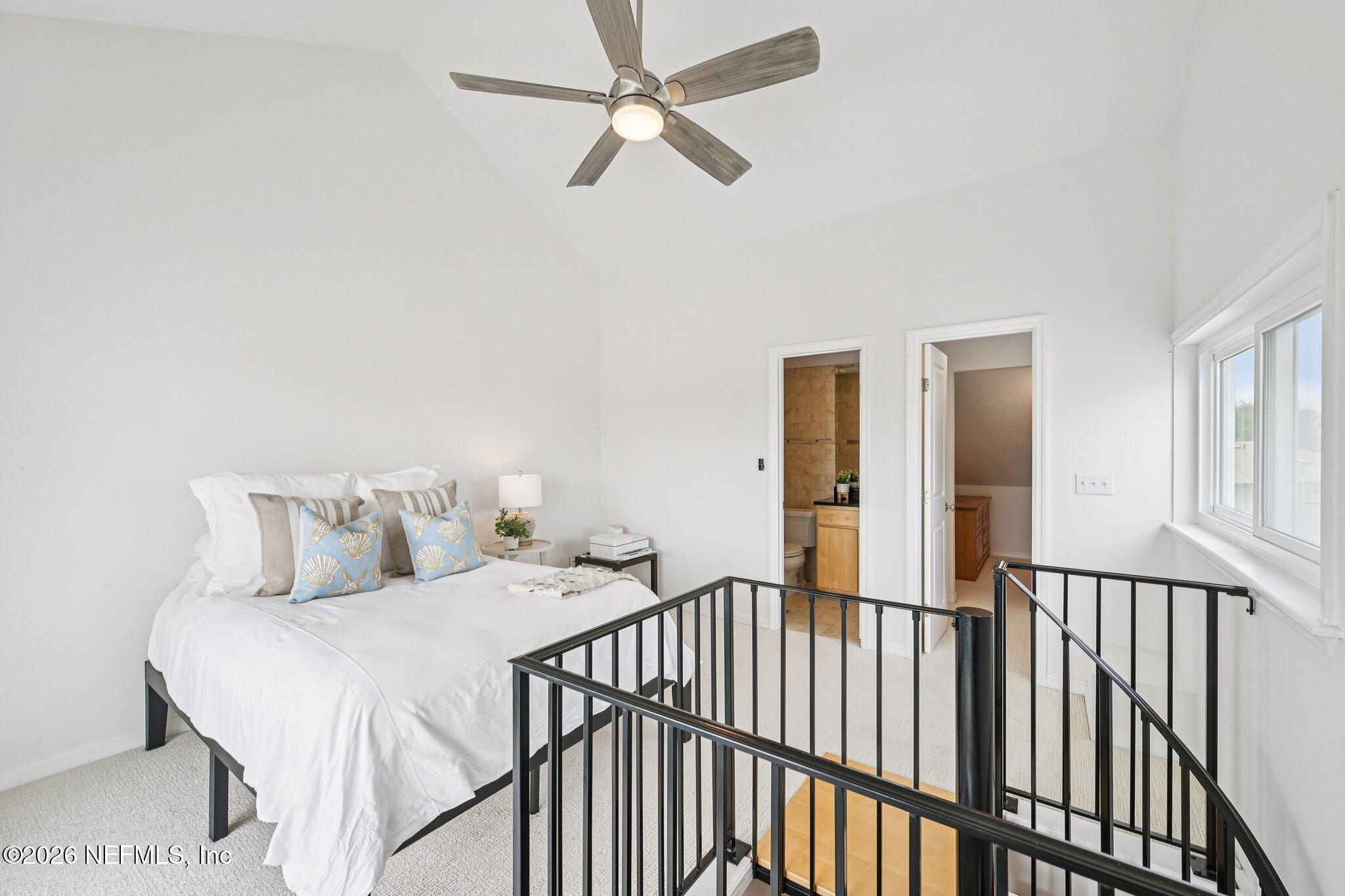 2802 2nd Street South Jacksonville Beach, FL 32250 - Photo 38 of 53 a bedroom with a bed and a chandelier fan
