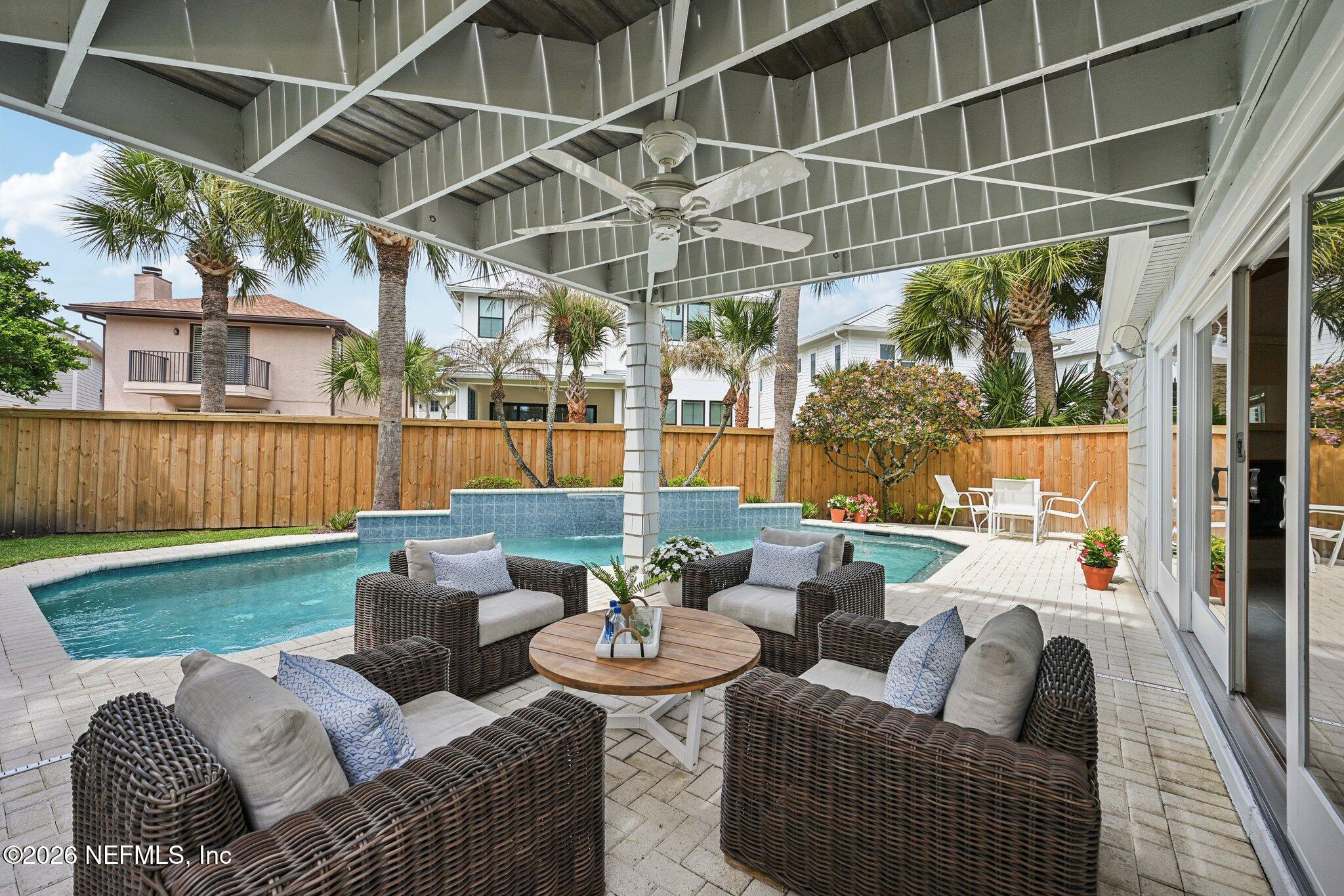 2802 2nd Street South Jacksonville Beach, FL 32250 - Photo 43 of 53 a view of a patio with couches chairs and wooden fence