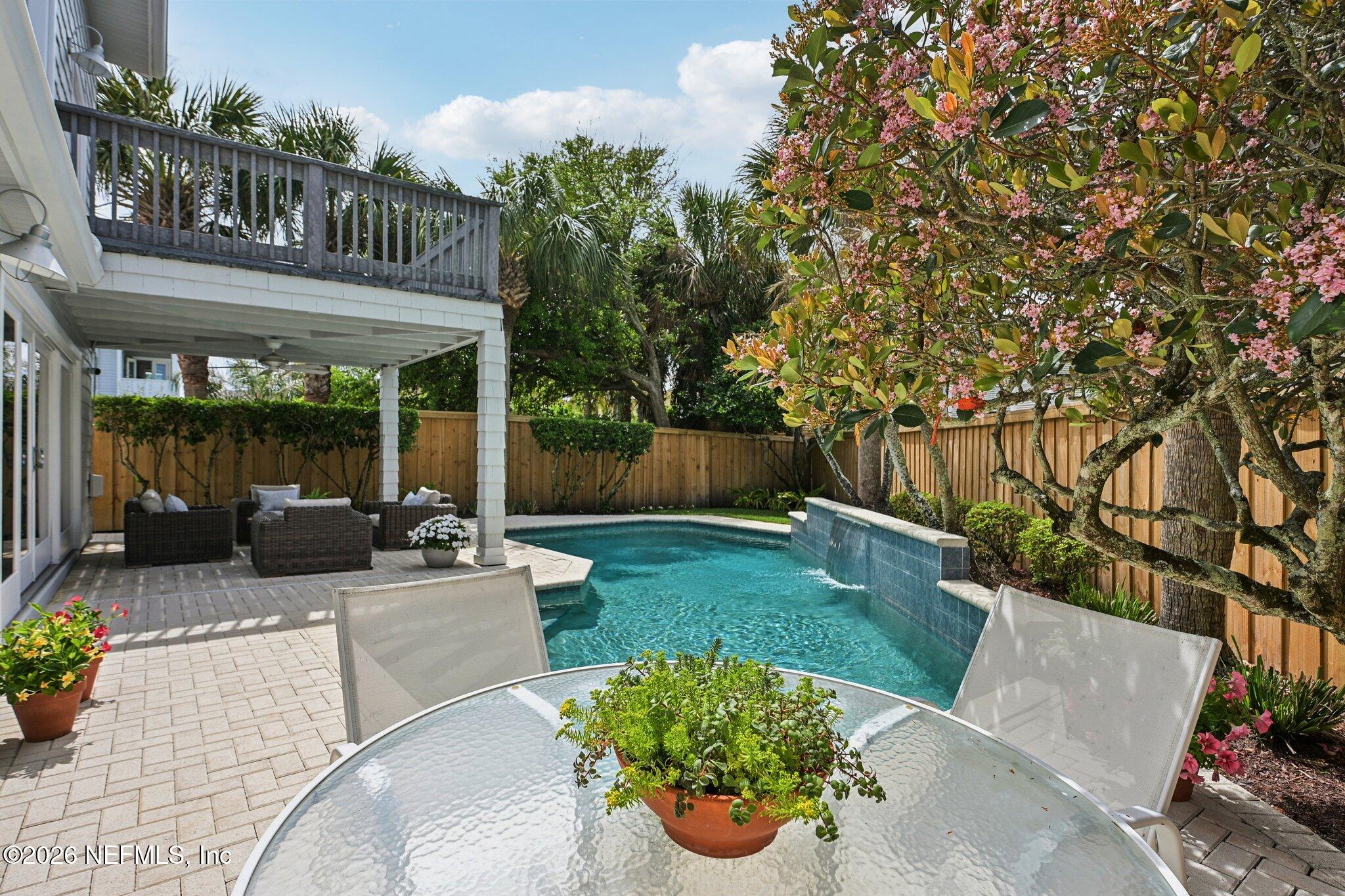 2802 2nd Street South Jacksonville Beach, FL 32250 - Photo 45 of 53 a view of a patio with couches table and chairs and potted plants