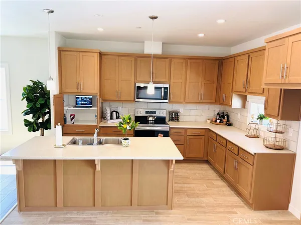a kitchen with granite countertop a sink a stove oven and granite counter tops