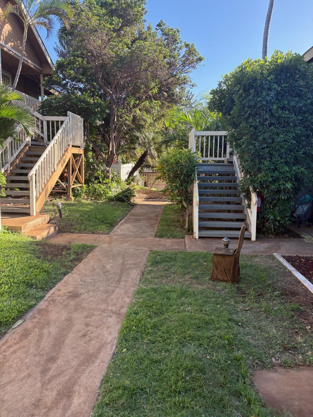 140 Uwapo Road, Unit 35204 Kihei, HI 96753 - Photo 16 of 16 a view of a yard with plants and a slide