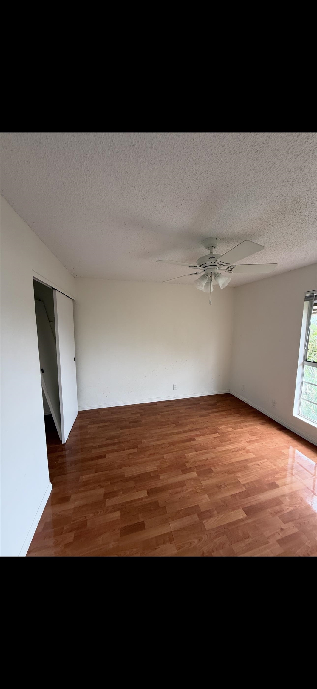 140 Uwapo Road, Unit 35204 Kihei, HI 96753 - Photo 5 of 16 a view of empty room with wooden floor
