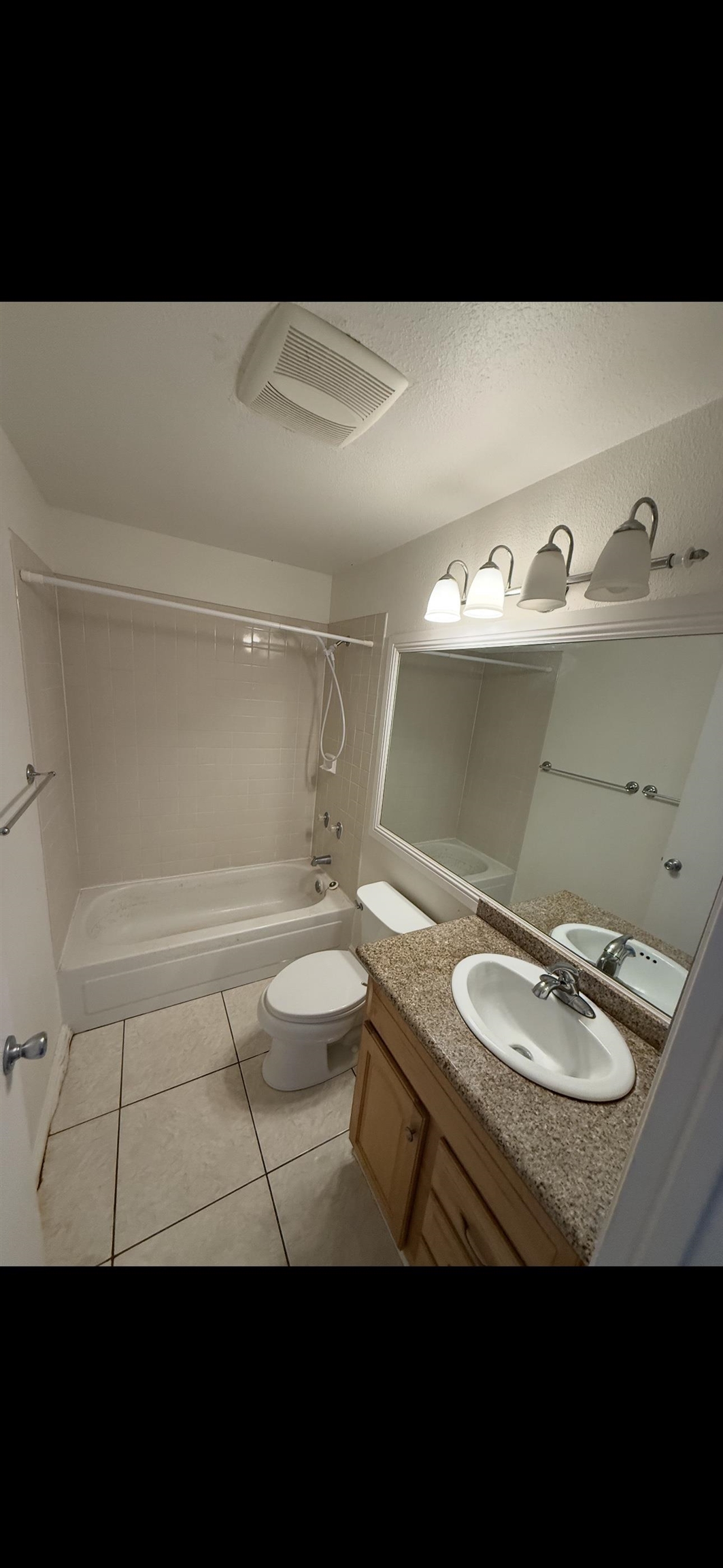 140 Uwapo Road, Unit 35204 Kihei, HI 96753 - Photo 10 of 16 a bathroom with a sink a toilet and a mirror
