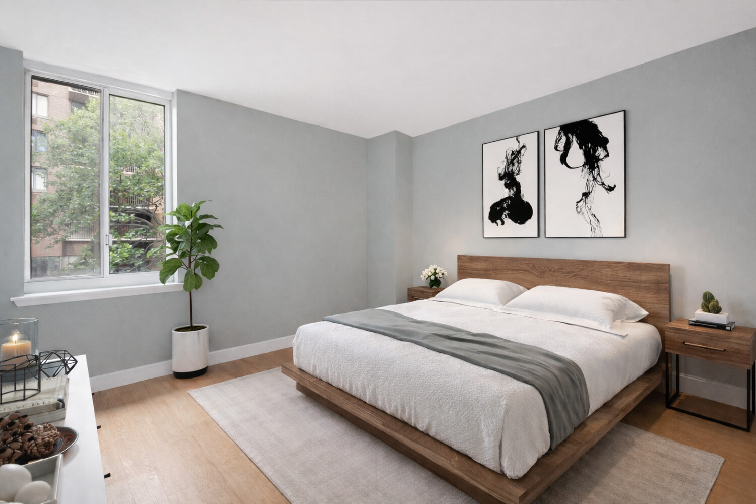 333 Rector Place, Unit 301 Manhattan, NY 10280 - Photo 4 of 7 a bedroom with a bed and a window