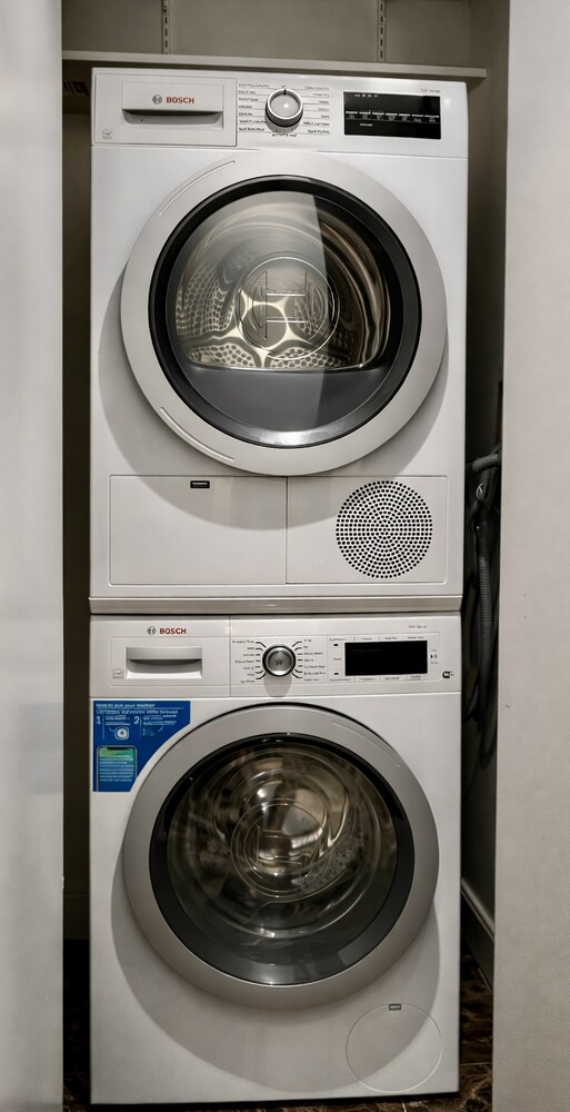 333 Rector Place, Unit 301 Manhattan, NY 10280 - Photo 7 of 8 a close up view of washer and dryer