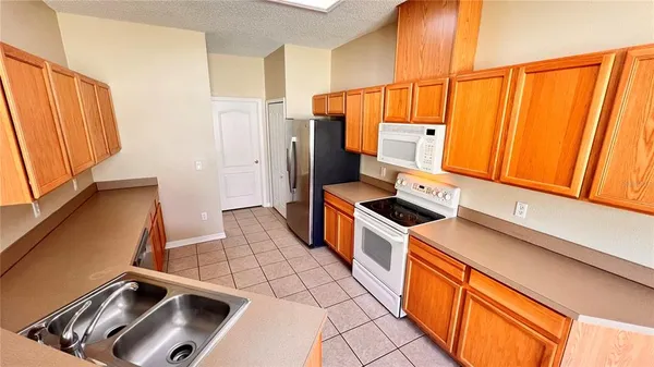 a kitchen that has a sink and a stove