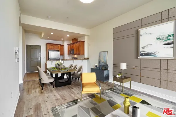 a living room with fireplace furniture and a table