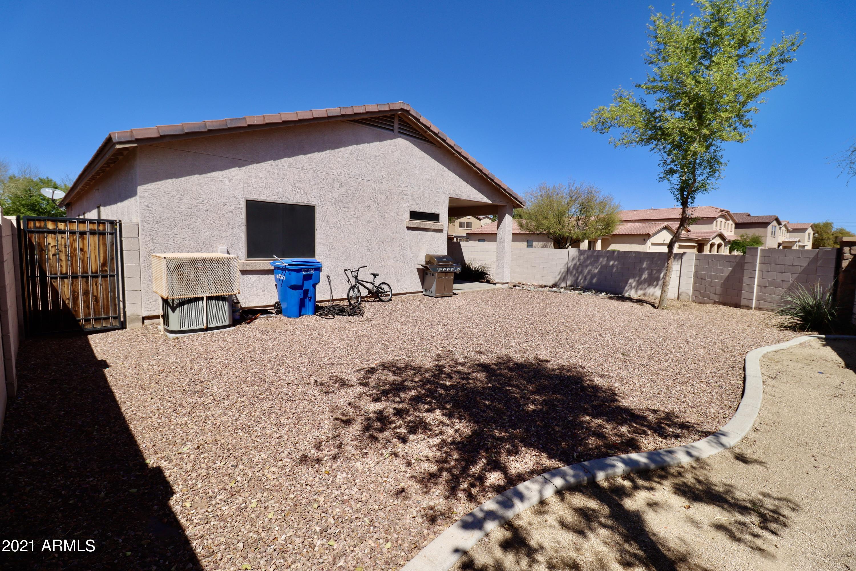 9223 West Belvoir Road Phoenix, AZ 85037 - Photo 21 of 25 Backyard to house