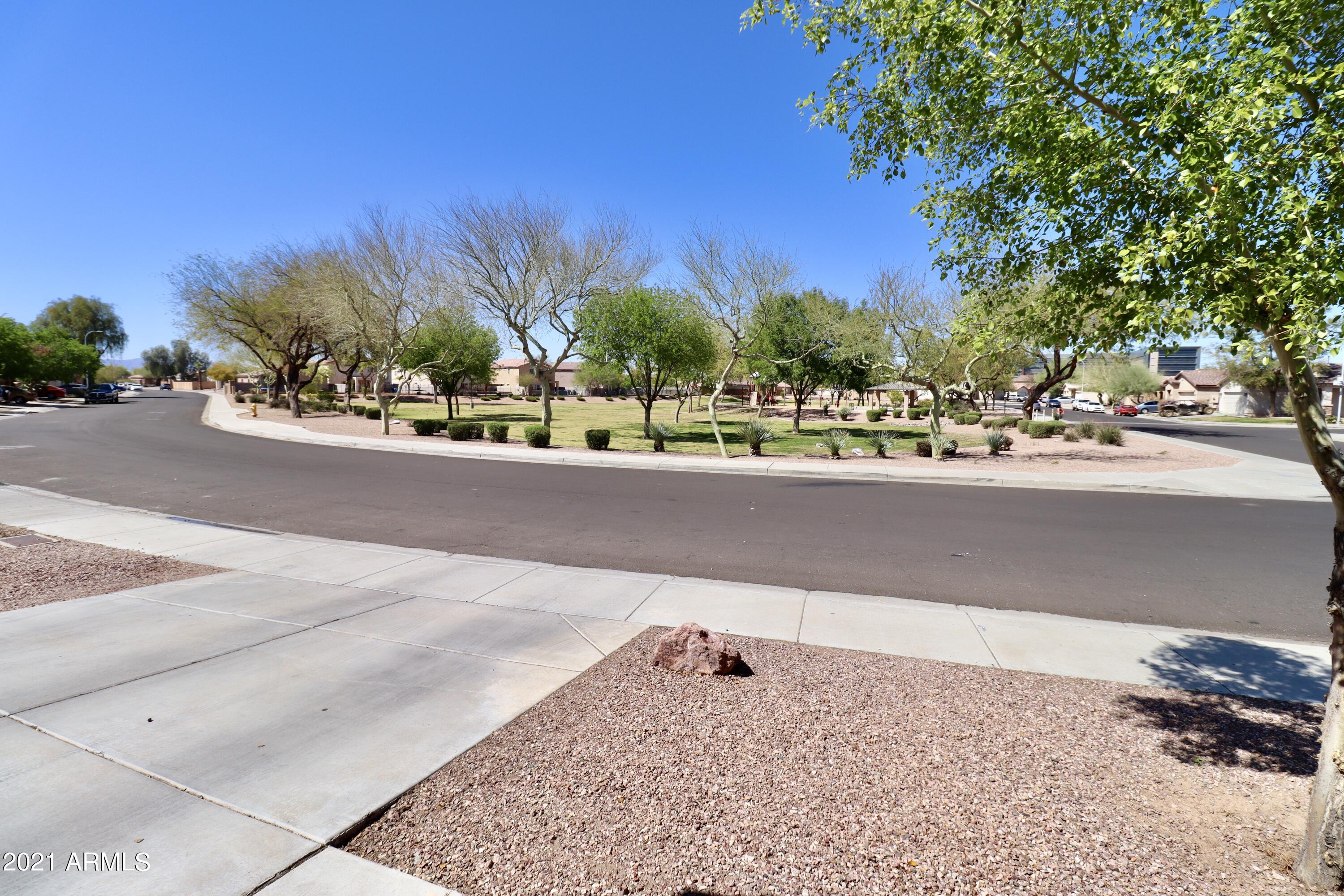 9223 West Belvoir Road Phoenix, AZ 85037 - Photo 24 of 25 View of front of House to Park