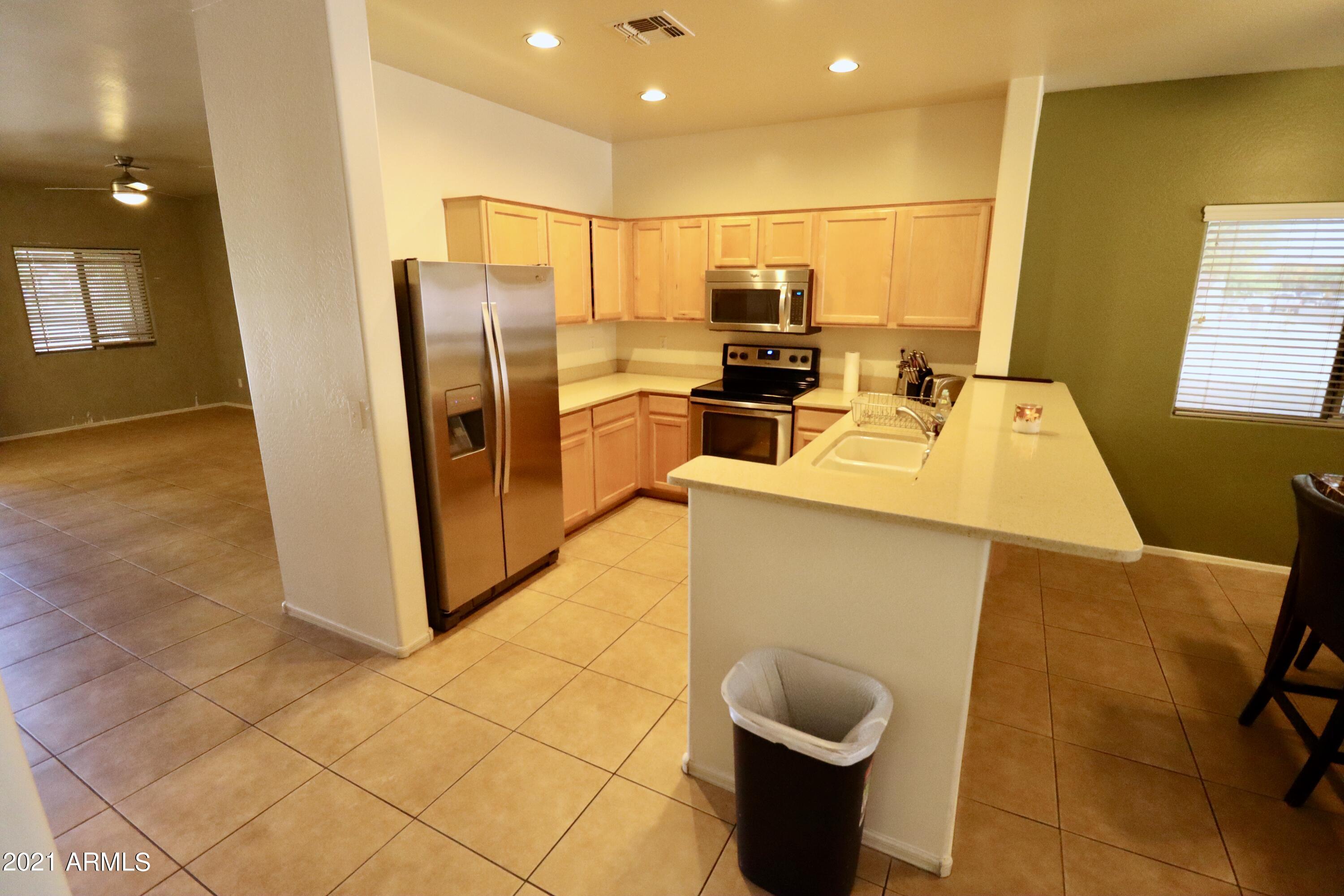 9223 West Belvoir Road Phoenix, AZ 85037 - Photo 6 of 25 Kitchen Part Front Rm