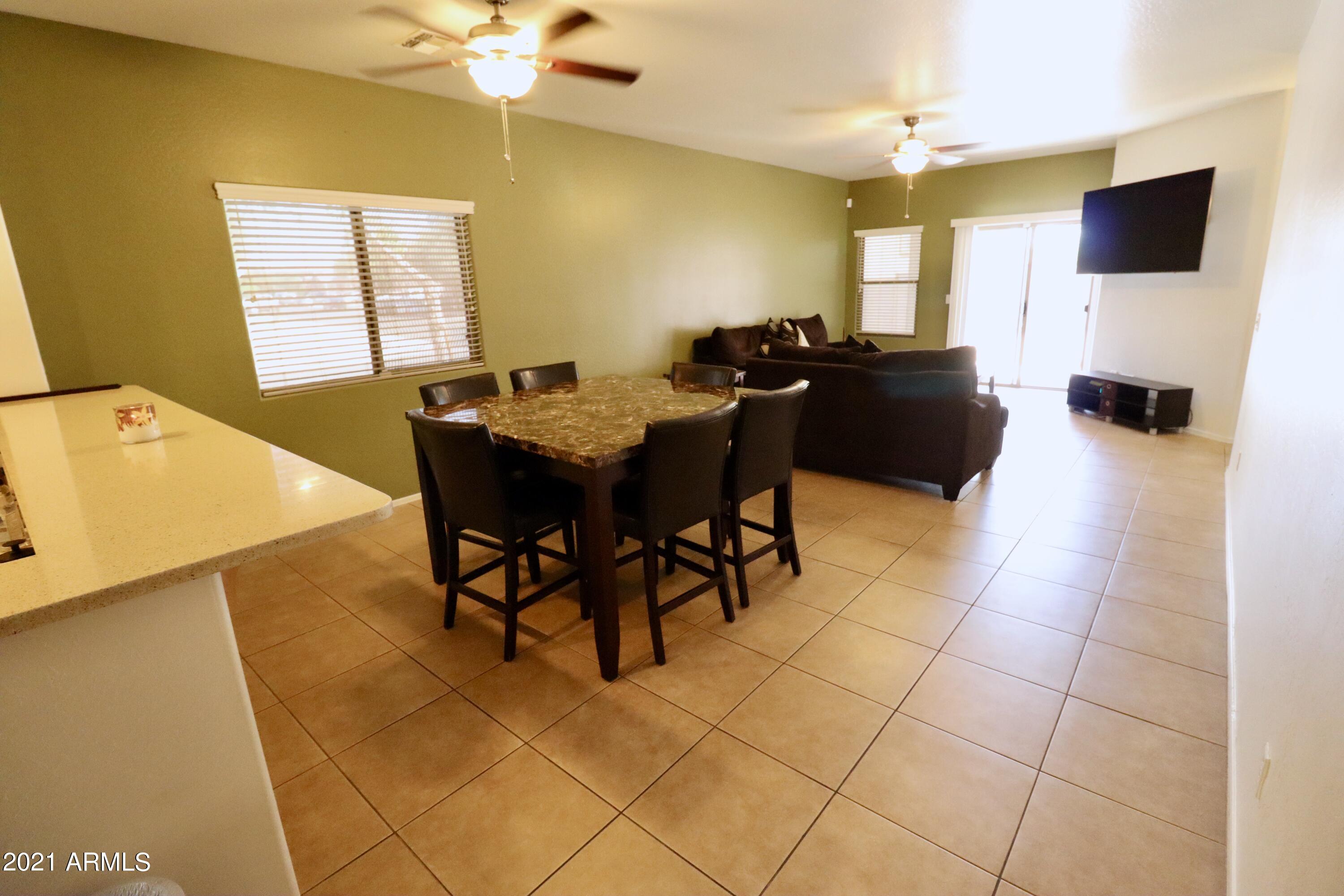 9223 West Belvoir Road Phoenix, AZ 85037 - Photo 8 of 25 Dining thru family rm