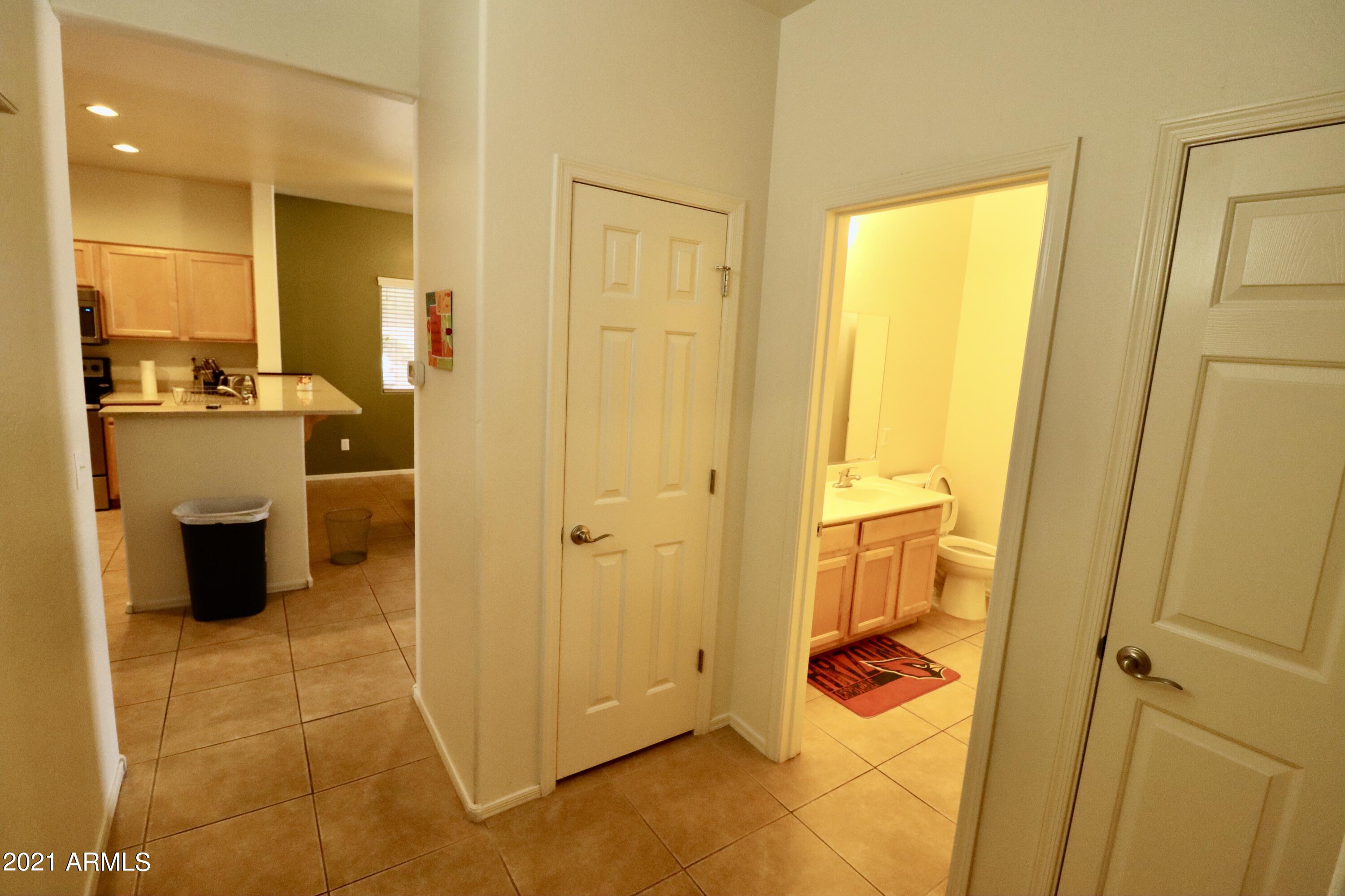9223 West Belvoir Road Phoenix, AZ 85037 - Photo 9 of 25 Hall 1 View to Kitchen.Bath