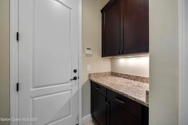 a view of a kitchen cabinets and sink