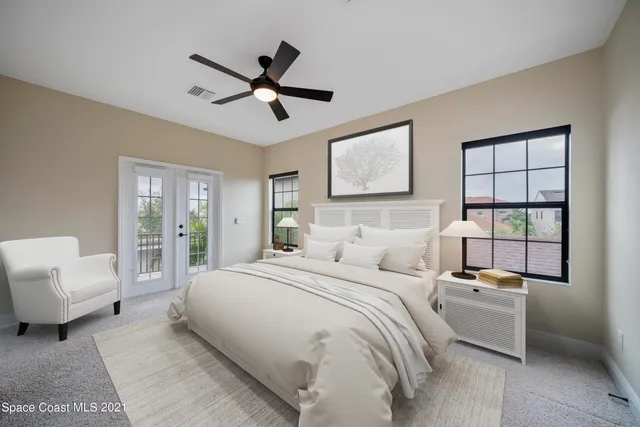 a bedroom with a bed furniture and window