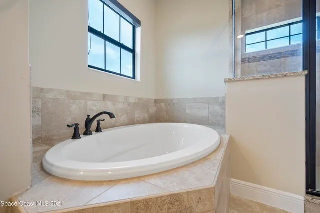 a bathroom with a sink and a window