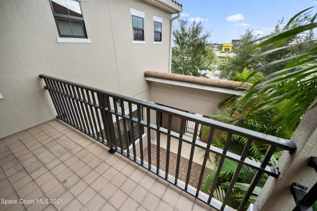 a balcony view with a garden