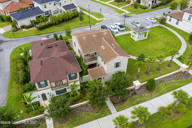 an aerial view of residential house with outdoor space and pool