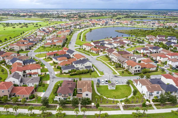 an aerial view of residential houses with outdoor space