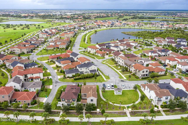 an aerial view of residential houses with outdoor space