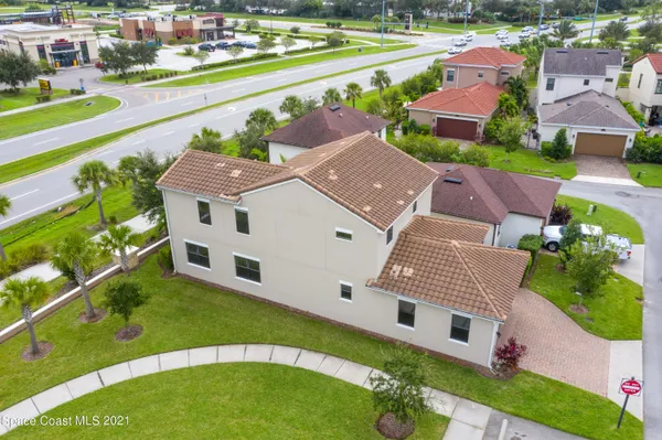 an aerial view of a house with a garden