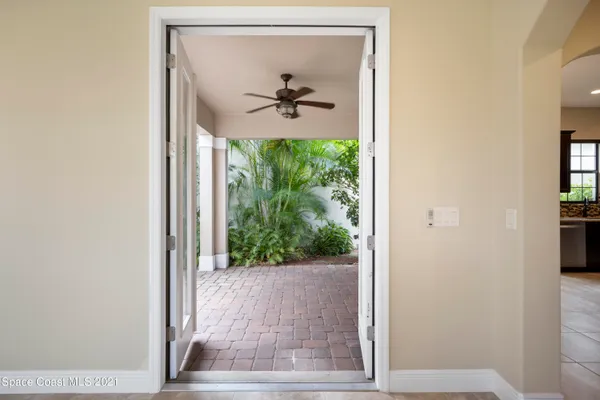 a view of a hallway with a glass door