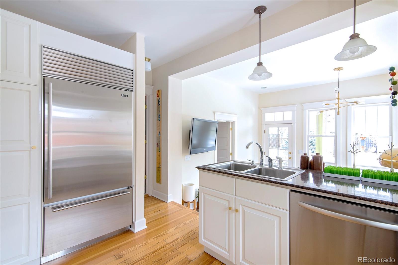 2137 Pine Street Boulder, CO 80302 - Photo 17 of 40 a kitchen with sink refrigerator and window
