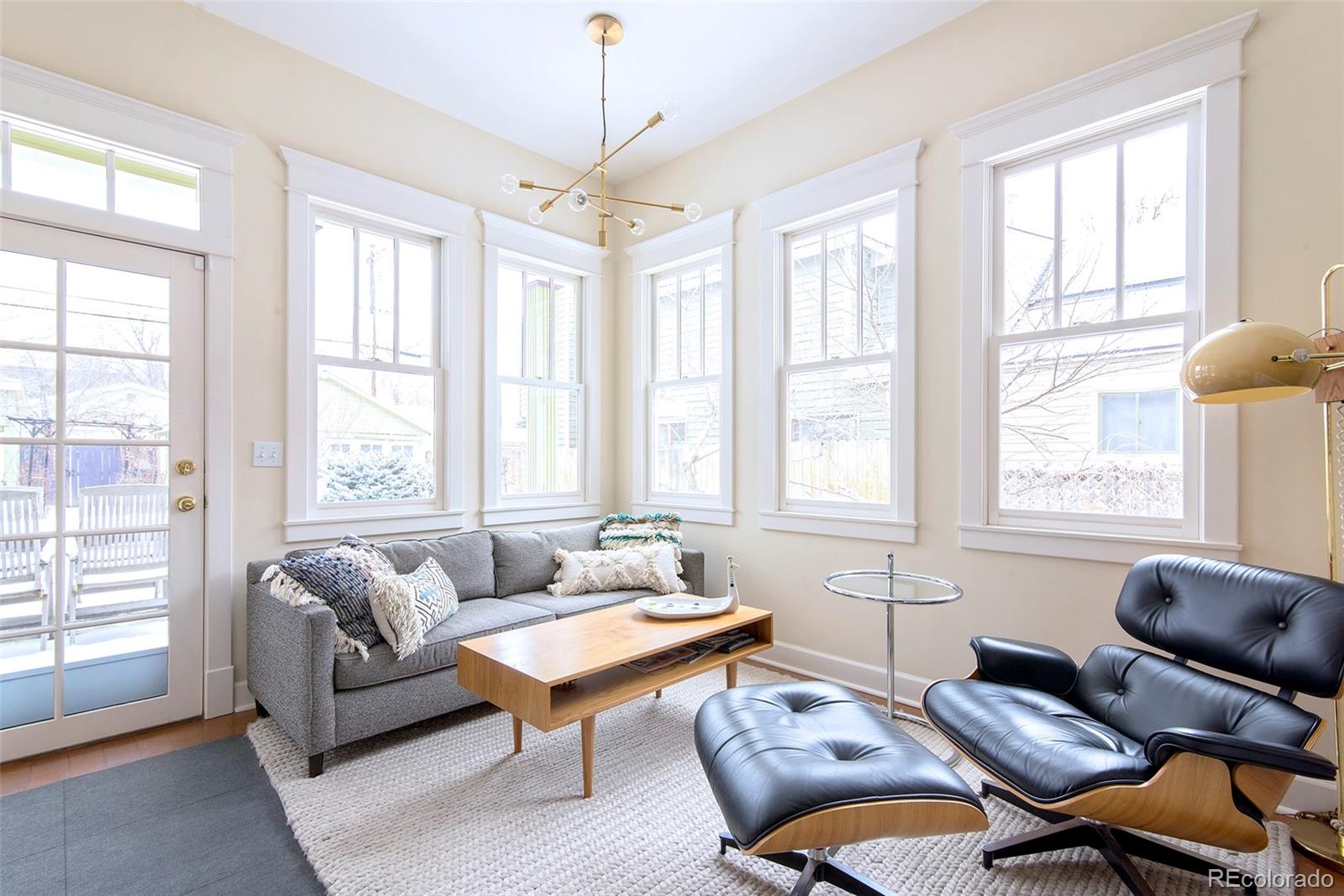 2137 Pine Street Boulder, CO 80302 - Photo 23 of 40 a living room with furniture and windows