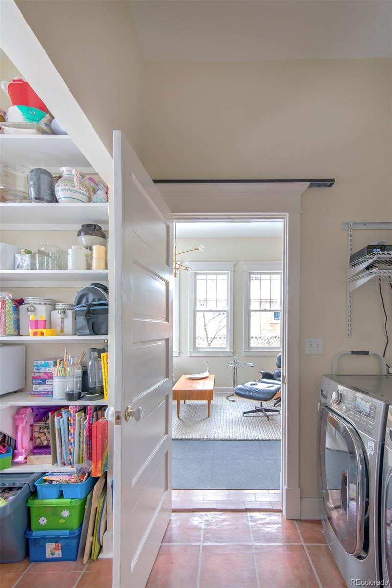 2137 Pine Street Boulder, CO 80302 - Photo 24 of 40 a living room with baby crib and furniture