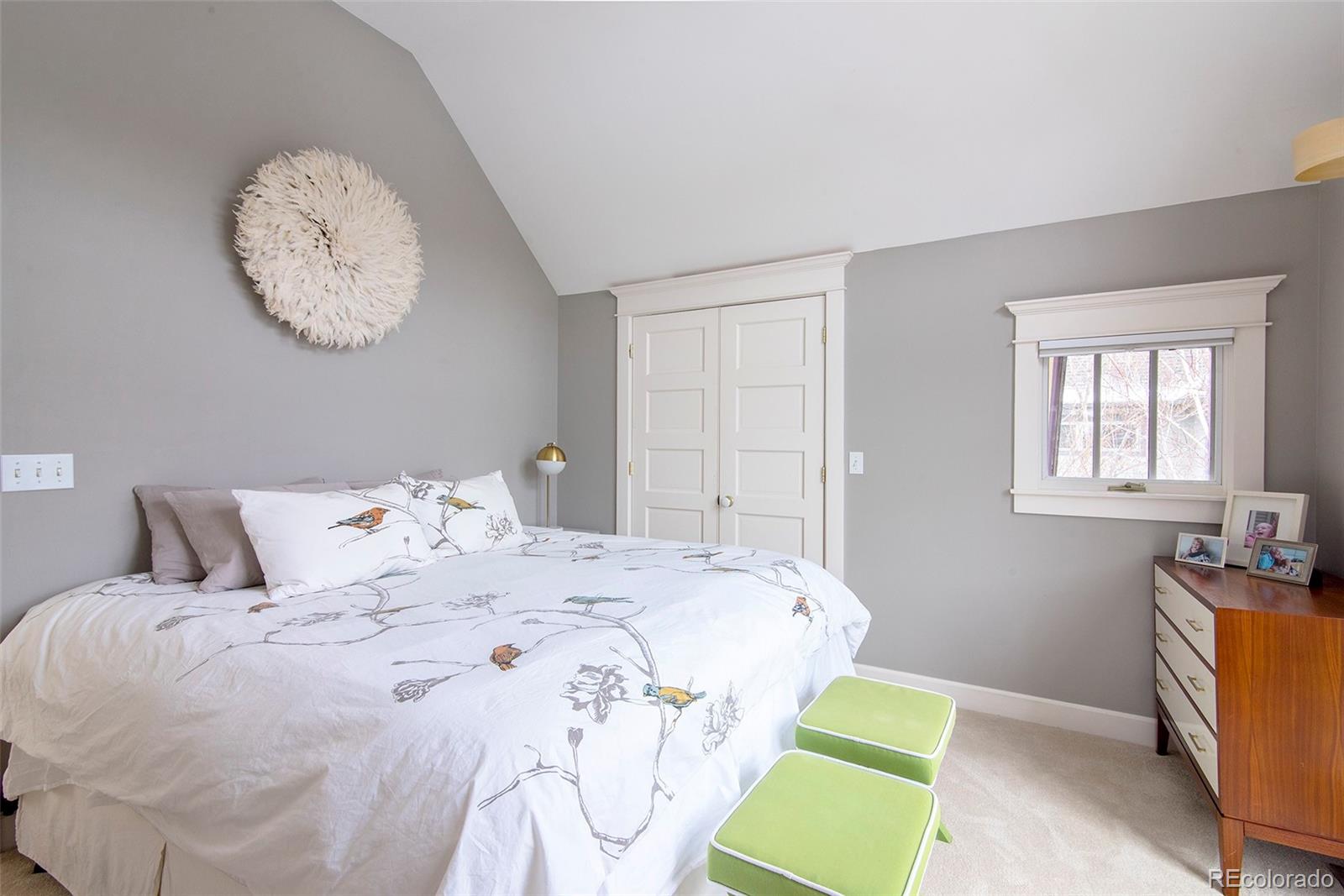 2137 Pine Street Boulder, CO 80302 - Photo 26 of 40 a bedroom with a bed and a chair