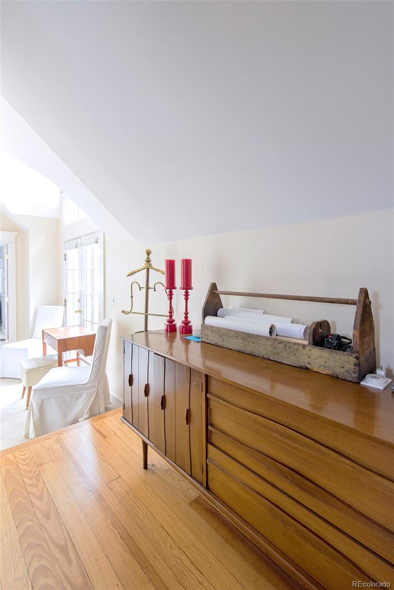 2137 Pine Street Boulder, CO 80302 - Photo 32 of 40 a bed room with a bed and cabinets