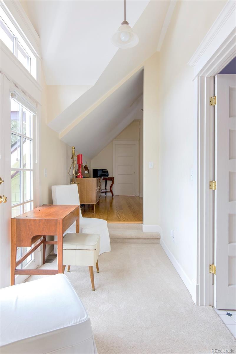 2137 Pine Street Boulder, CO 80302 - Photo 33 of 40 a living room with furniture and a large window
