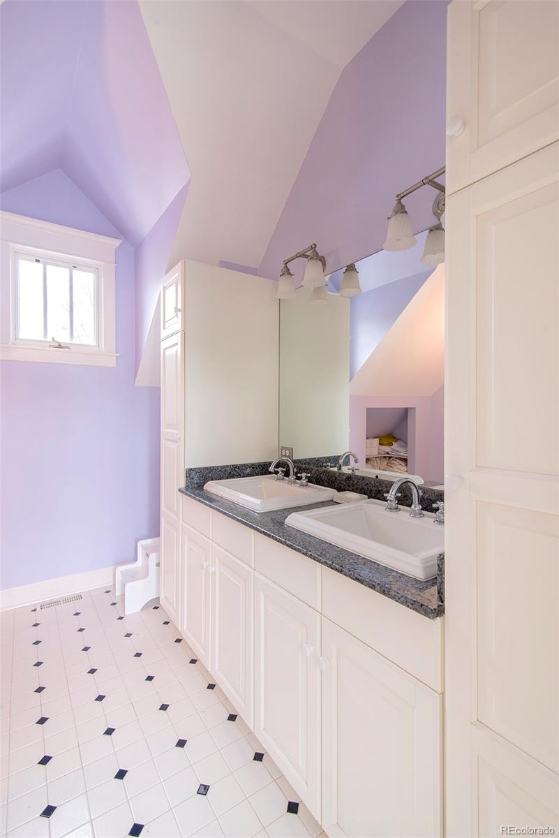 2137 Pine Street Boulder, CO 80302 - Photo 36 of 40 a kitchen with a sink stove and cabinets