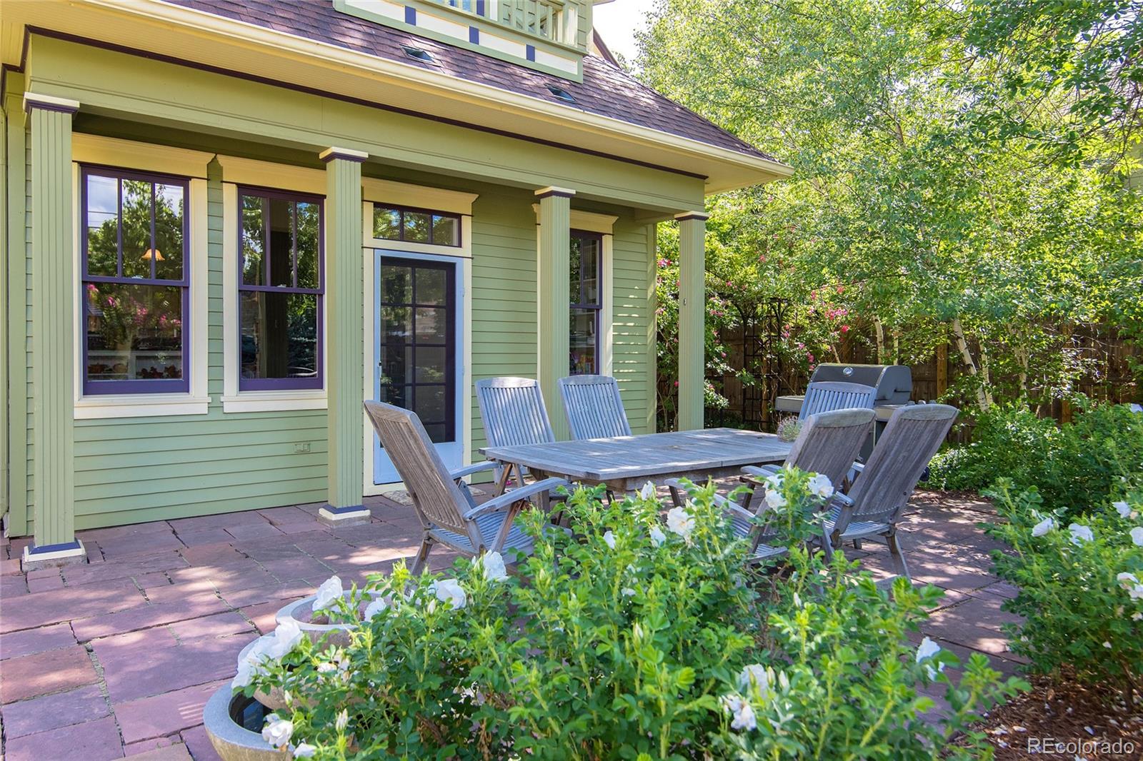 2137 Pine Street Boulder, CO 80302 - Photo 38 of 40 a view of a chair and table in backyard of the house