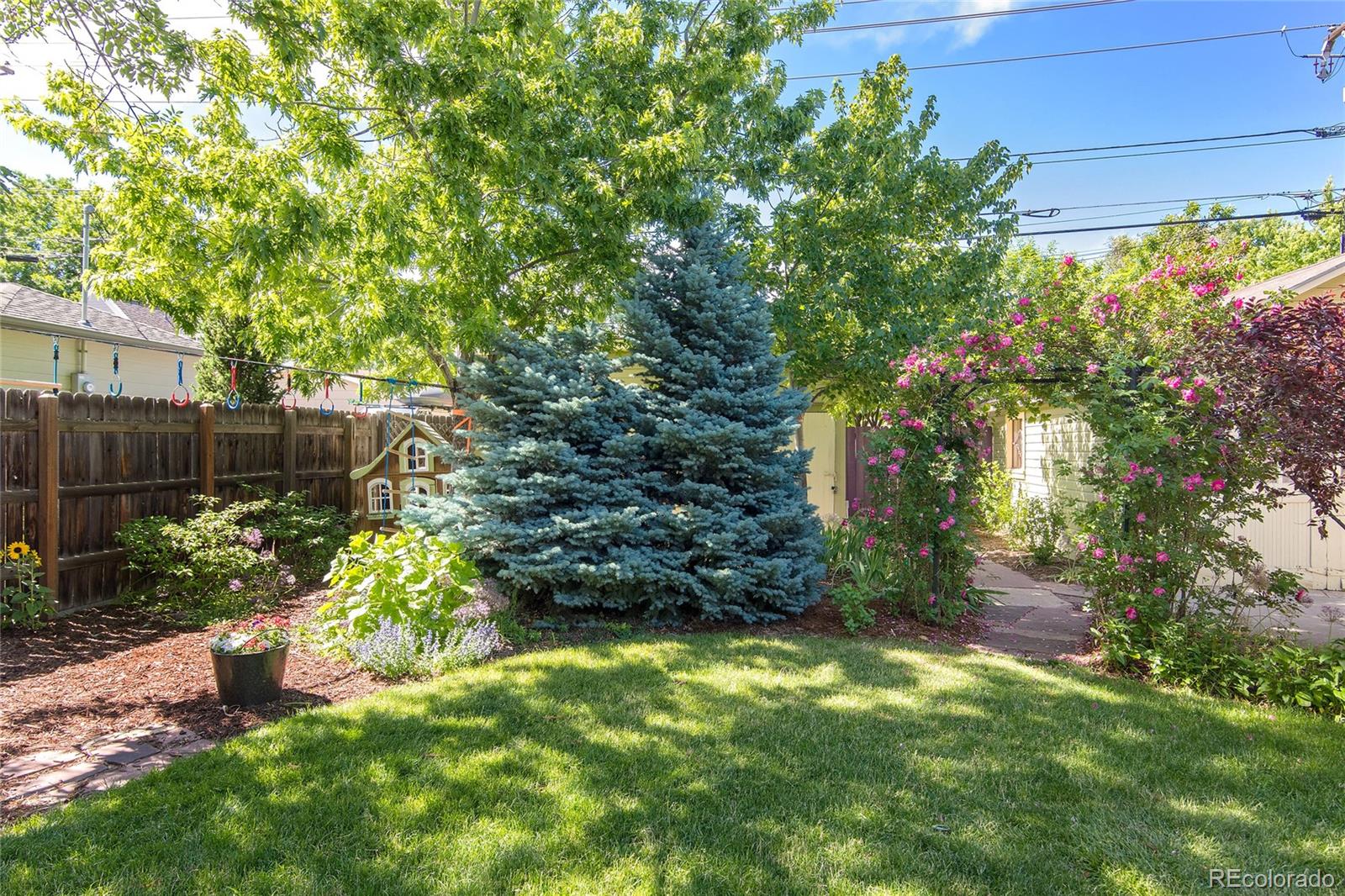2137 Pine Street Boulder, CO 80302 - Photo 39 of 40 a backyard of a house with lots of green space