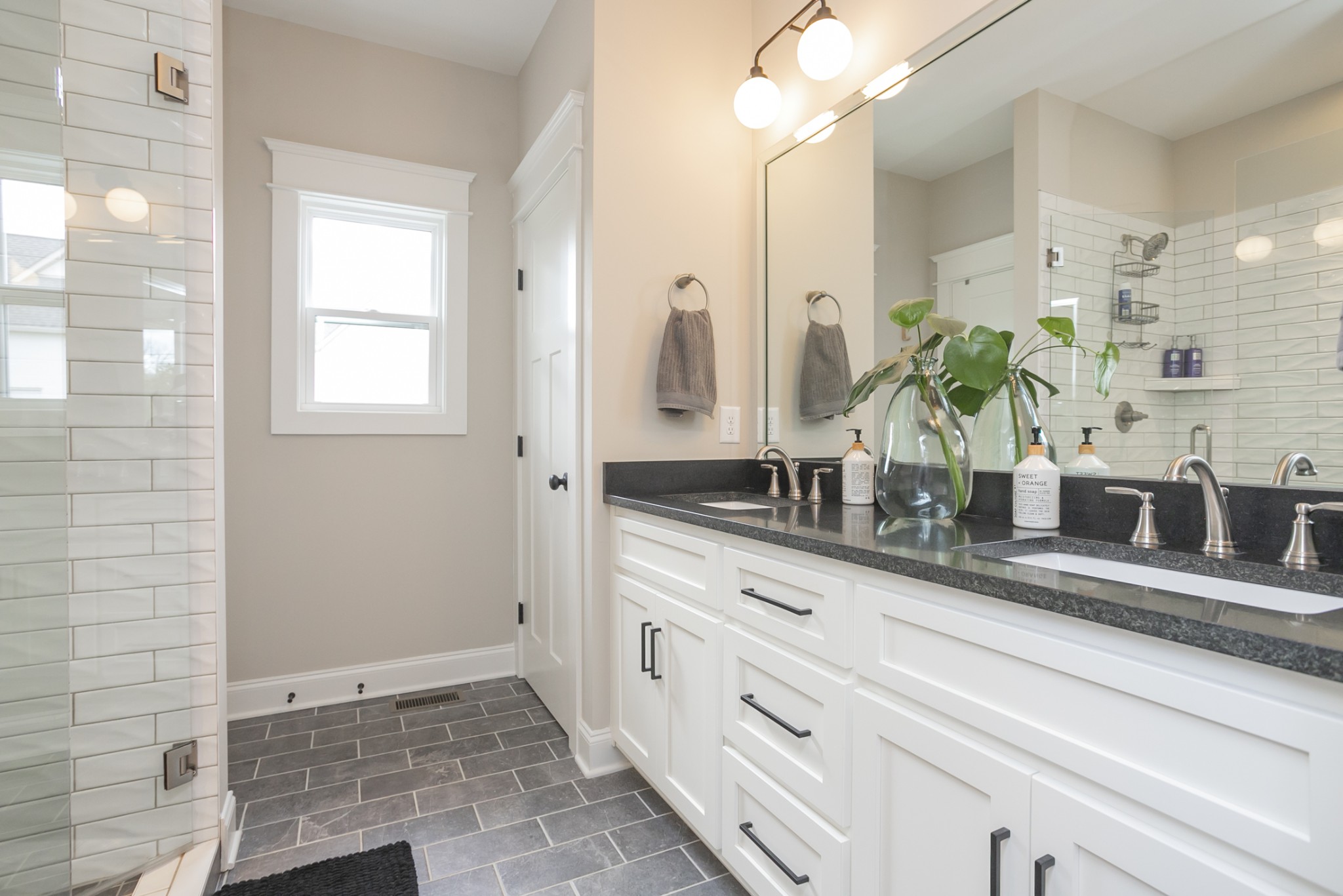6599 Simmons Bluff Road Lebanon, TN 37090 - Photo 11 of 23 a bathroom with a double vanity sink a mirror and a shower