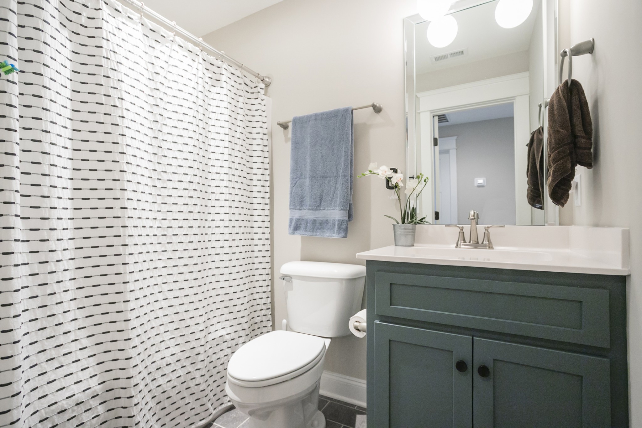 6599 Simmons Bluff Road Lebanon, TN 37090 - Photo 17 of 23 a bathroom with a toilet a sink and mirror