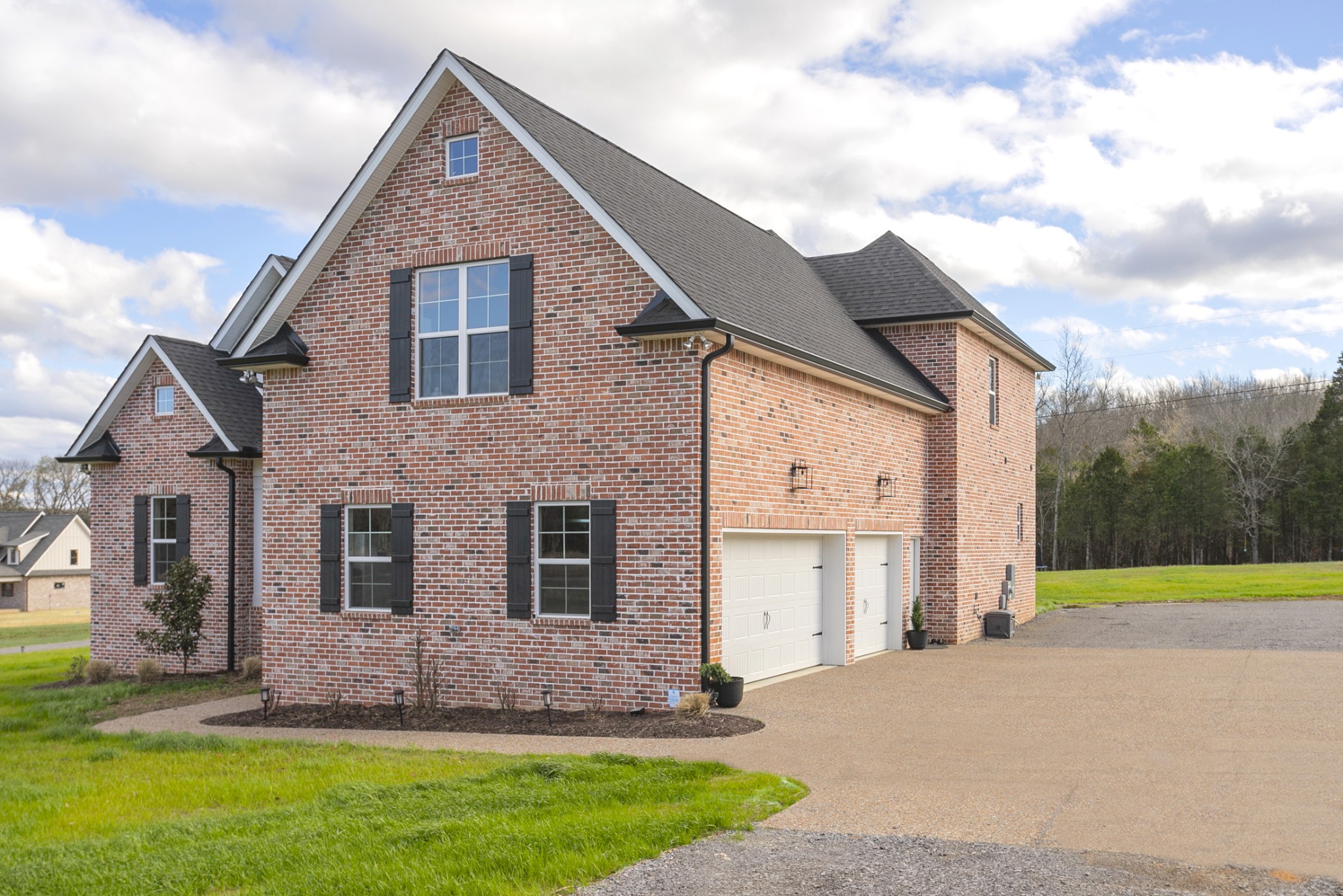 6599 Simmons Bluff Road Lebanon, TN 37090 - Photo 2 of 23 a front view of a house with a yard and garage