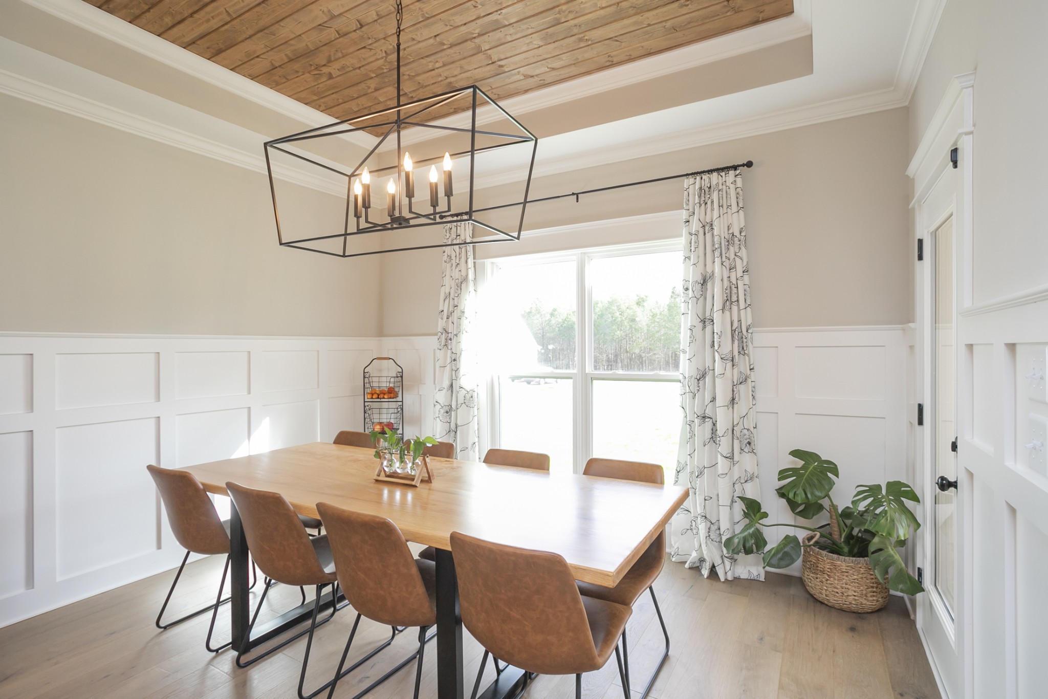 6599 Simmons Bluff Road Lebanon, TN 37090 - Photo 8 of 23 a dining room with furniture potted plants and wooden floor