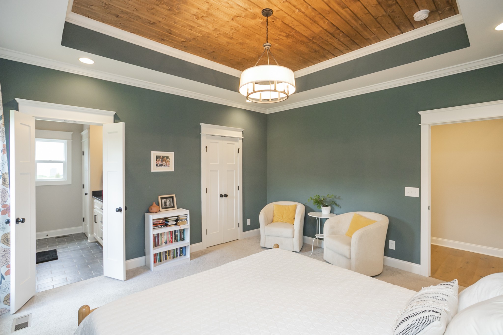 6599 Simmons Bluff Road Lebanon, TN 37090 - Photo 10 of 23 a bedroom with furniture and a chandelier