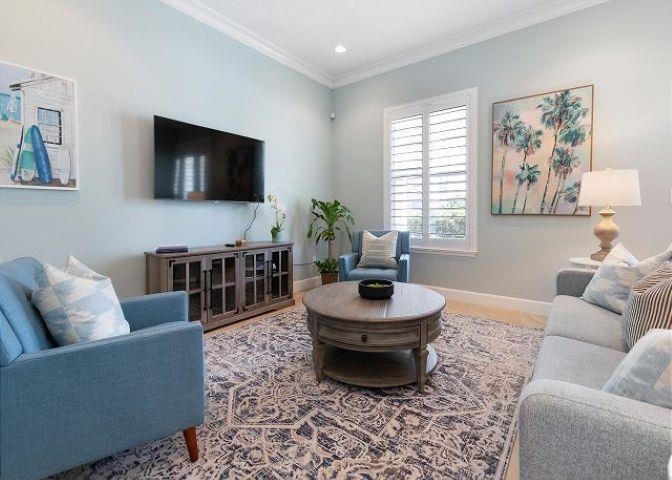 503 Cinnamon Beach Lane Palm Coast, FL 32137 - Photo 12 of 50 a living room with furniture and a flat screen tv