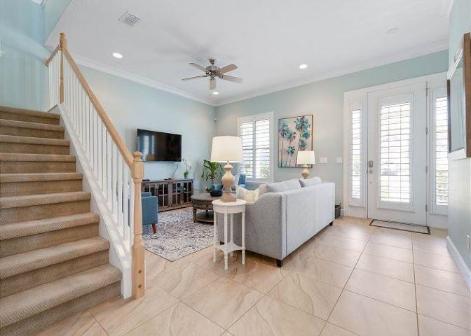 503 Cinnamon Beach Lane Palm Coast, FL 32137 - Photo 15 of 50 a living room with furniture and a flat screen tv