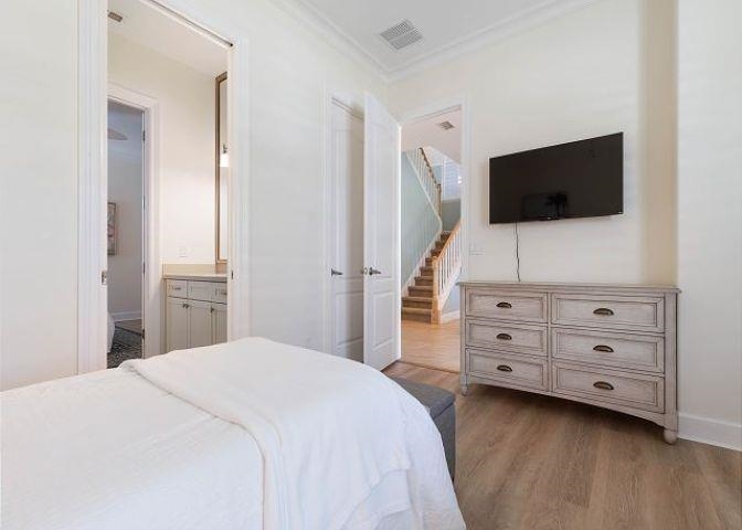 503 Cinnamon Beach Lane Palm Coast, FL 32137 - Photo 16 of 50 a bedroom with a bed and a flat screen tv