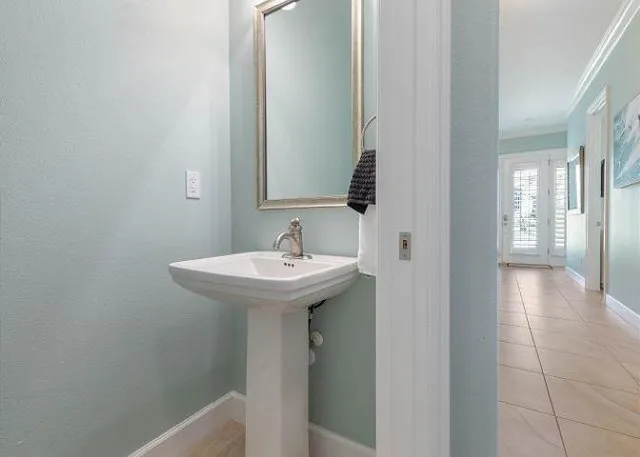 a bathroom with a sink and mirror
