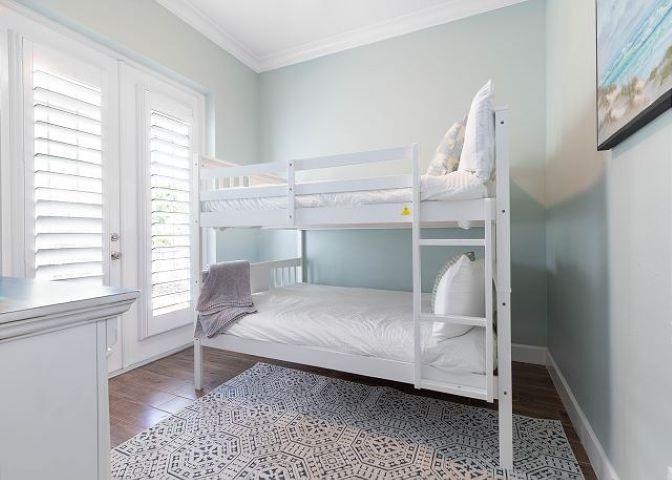 503 Cinnamon Beach Lane Palm Coast, FL 32137 - Photo 19 of 50 a bedroom with a bed and a window