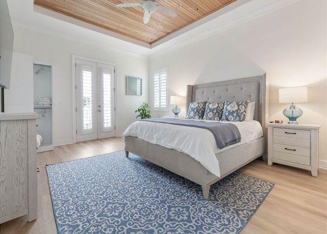 503 Cinnamon Beach Lane Palm Coast, FL 32137 - Photo 20 of 50 a bedroom with a large bed and a couch