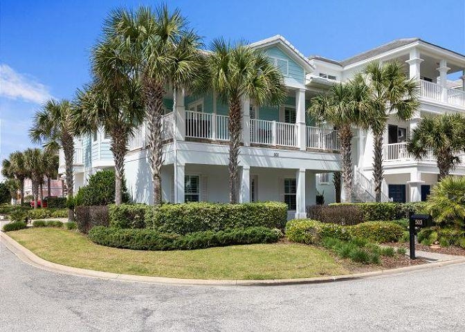503 Cinnamon Beach Lane Palm Coast, FL 32137 - Photo 2 of 50 a front view of a house with a garden
