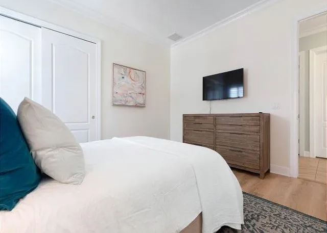 a bedroom with a bed and furniture