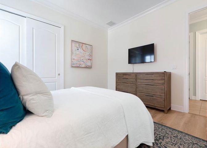 503 Cinnamon Beach Lane Palm Coast, FL 32137 - Photo 31 of 50 a bedroom with a bed and furniture