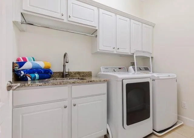 a utility room with dryer and washer